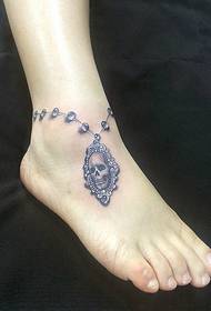 girls ankle Gorgeous pearl skull anklet tattoo