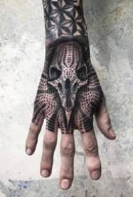 Dead black hand back tattoo - From the arm to the dark black tattoo pattern on the back of the hand