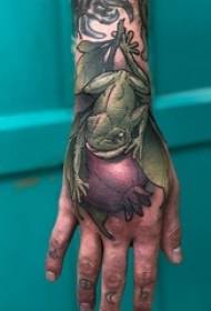 hand back tattooed male hand on the back of the plant and frog tattoo picture