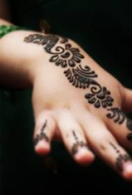 girl hand back on black abstract lines delicate flower tattoo picture