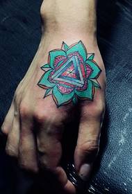 a colorful flower tattoo pattern on the back of the hand is very eye-catching