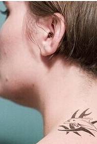 Beautiful girl in the neck of a beautiful little fish tattoo picture