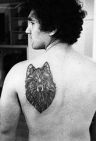 back tattoo male male student on the back of a black wolf head tattoo picture
