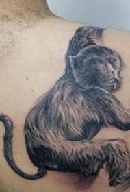 tattooed monkey boy on the back of a black monkey tattoo picture