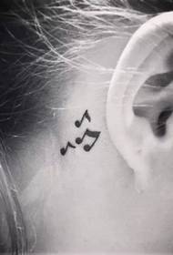 small tattoo hidden behind the ear