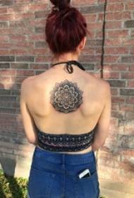 tattoo Back female girl on the back of a black mandala tattoo picture