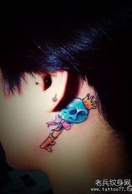 girl's ear a skull key tattoo pattern