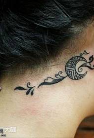 Ear moon totem tattoo
