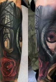 arm mysterious eyes and rose forest tattoo pattern
