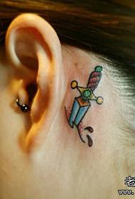 girl's ear a small dagger tattoo pattern