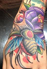 hand-colored insect tattoo pattern