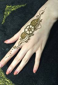 goddess slender little hand with a beautiful picture of Henna tattoo