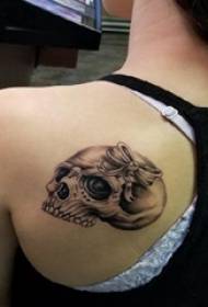 creative couple tattoo couple on the back Painted skull tattoo picture