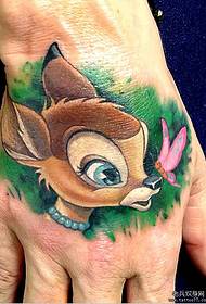a cute sika deer tattoo on the back of the hand