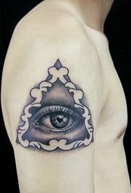 big 3D big eye tattoo surrounded by a geometric triangle