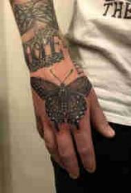 3d butterfly Tattooed male hand on the back of a black butterfly tattoo picture