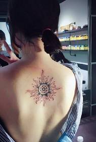 small skinny girl back small sun tattoo pattern