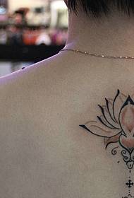 fashion lotus tattoo pattern above the spine