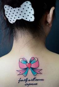 back color bow tattoo