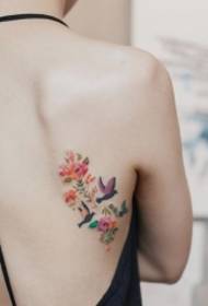 back small fresh flowers and small bird painted tattoo pattern