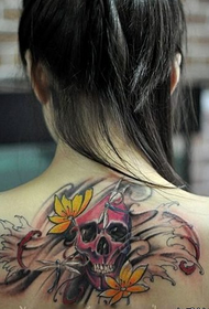 girl's back a colorful skull tattoo pattern