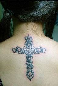 tatuatge de creu de l'esquena de noia