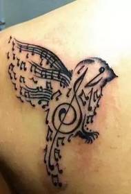 nugaros peties paukščio užrašo tatuiruotė