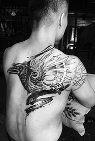 cover half of the back black and white crow tattoo picture