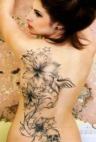 European beauty hot and charming back tattoo