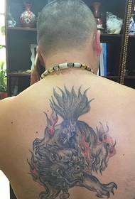 The traditional unicorn tattoo pattern in the middle of the back