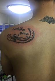 men's back personality English word tattoo tattoo