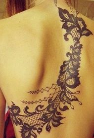 beautiful lace tattoo on the back of the beautiful woman