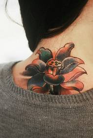 beautiful lotus tattoo on the back of the girl