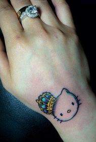 woman's wrist cute cat and crown tattoo pattern