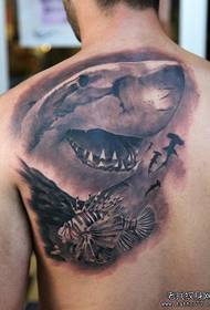 a shark tattoo on the back