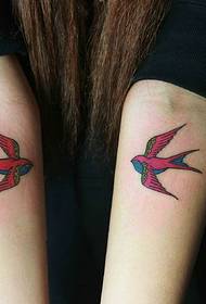 two pairs of small swallow wrist tattoos