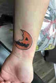 tattoo cartoon male wrist on the colored pumpkin moon tattoo picture