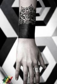 wrist black bracelet and vanilla tattoo pattern