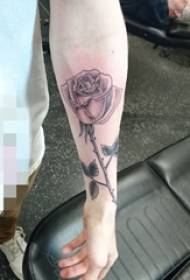 painted rose tattoo picture on the wrist