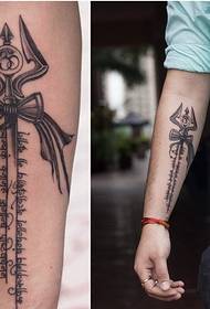 a small trident tattoo picture on the side wrist