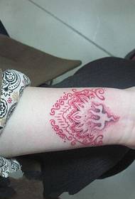 female personality red dotted totem tattoo