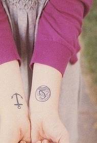 girls arm simple anchor totem tattoo