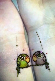Couple wrist On the cute parrot tattoo