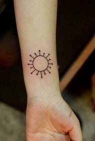 female wrist sun totem tattoo
