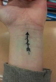 Black arrow tattoo on the boy's wrist