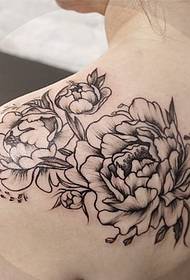 female tattoo outside the flower tattoo pattern