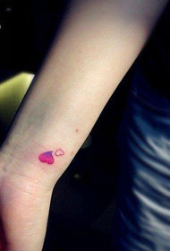 girl wrist small love tattoo pattern