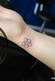 Girls' wrists are small and beautiful cherry blossom tattoos