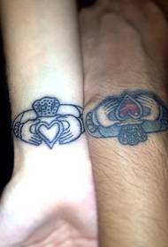 Wrist couple ring tattoo
