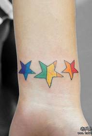 Girl's wrist small colorful five-pointed star tattoo pattern